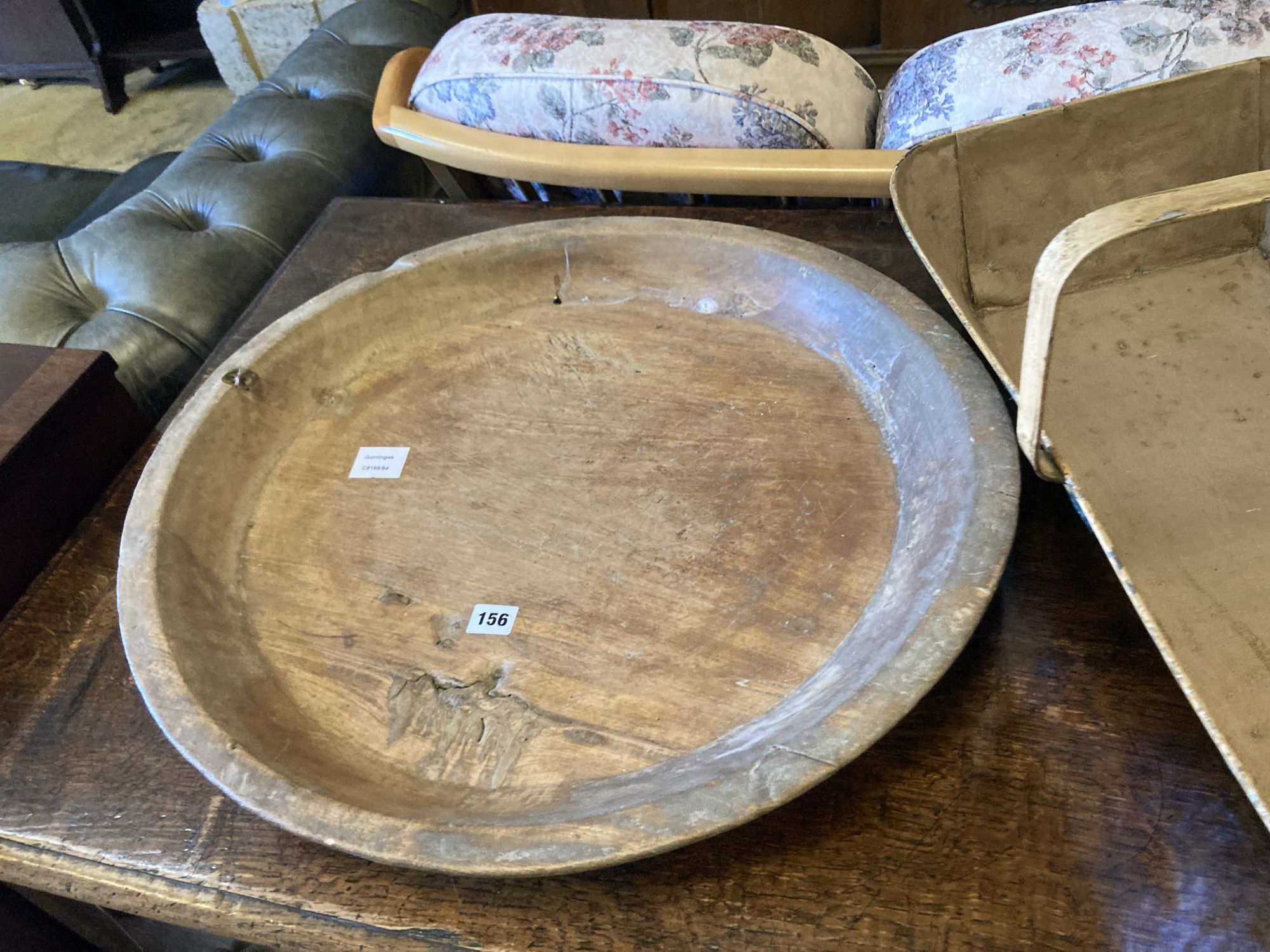 A circular treen shallow bowl and a painted toleware trug, width 69cm, depth 36cm, height 32cm